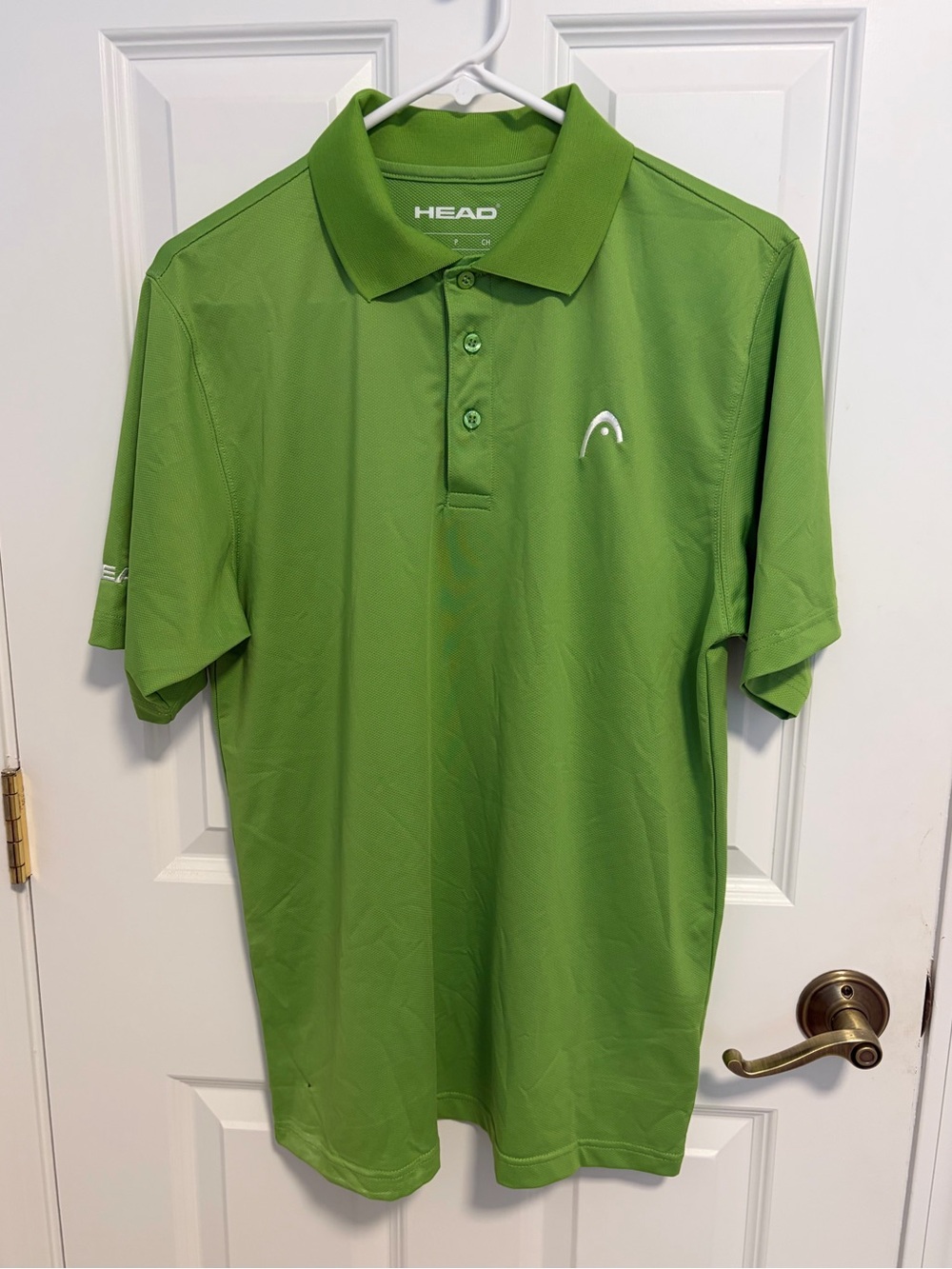 Head men’s shirt sleeve sz small tennis/golf polo. Collared, Bright lime green